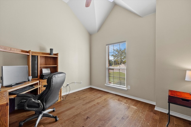 office with hardwood / wood-style flooring, ceiling fan, and high vaulted ceiling