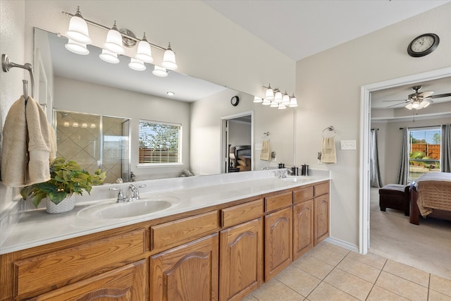 bathroom featuring tile patterned floors, ceiling fan, plenty of natural light, and vanity