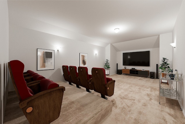 cinema room featuring light carpet and lofted ceiling