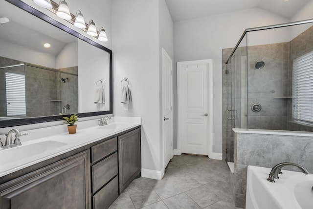 bathroom featuring tile patterned flooring, vanity, lofted ceiling, and shower with separate bathtub