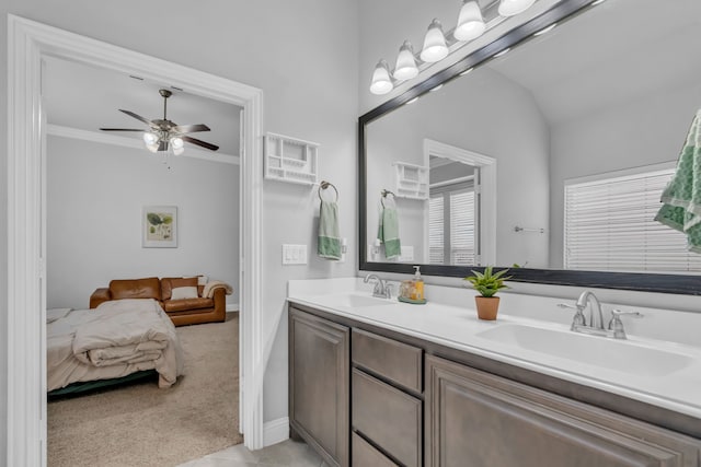 bathroom with ceiling fan, tile patterned flooring, vaulted ceiling, vanity, and ornamental molding