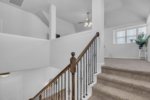 stairway with ceiling fan, carpet floors, and high vaulted ceiling