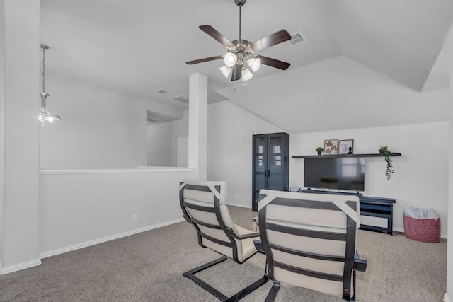 carpeted office space with ceiling fan and lofted ceiling