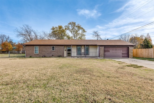 single story home featuring a garage and a front yard