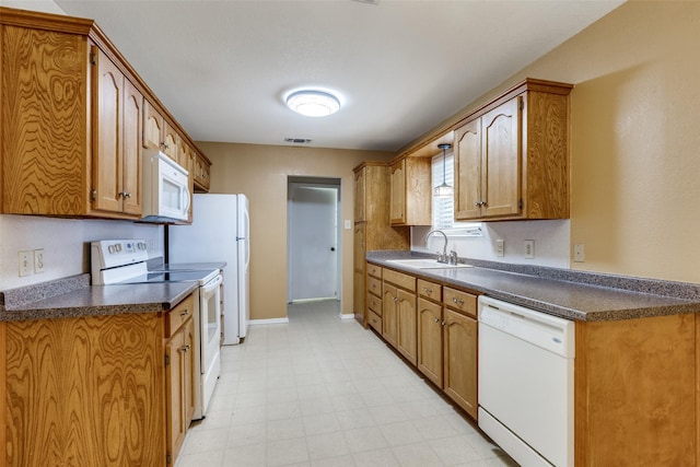 kitchen with sink and white appliances