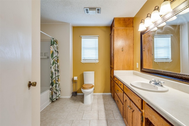 full bathroom with shower / bath combination with curtain, tile patterned floors, vanity, a textured ceiling, and toilet