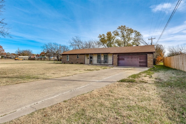 ranch-style house with a garage and a front yard