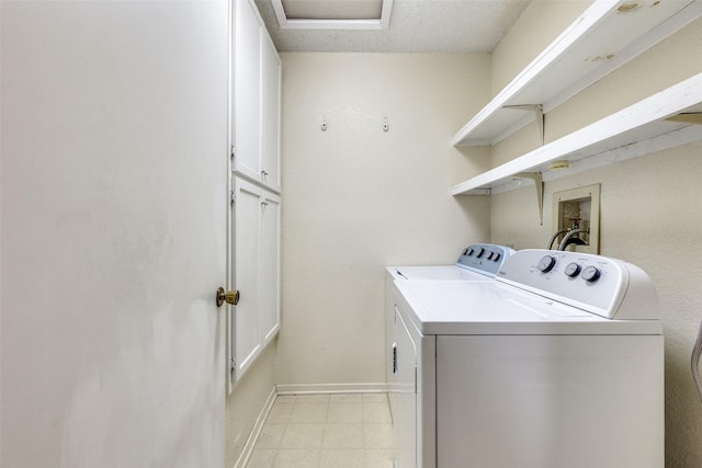 laundry area featuring cabinets and independent washer and dryer