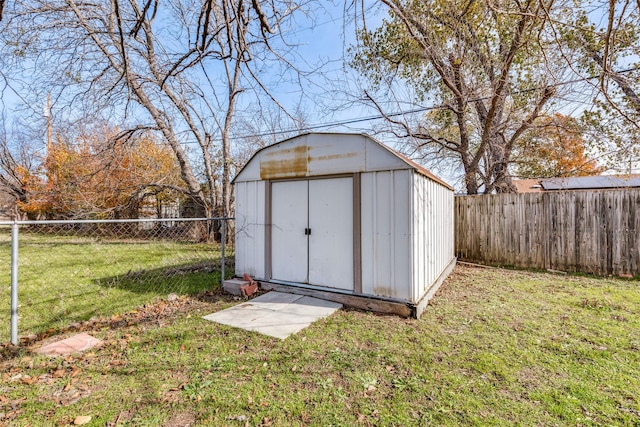 view of outdoor structure with a lawn