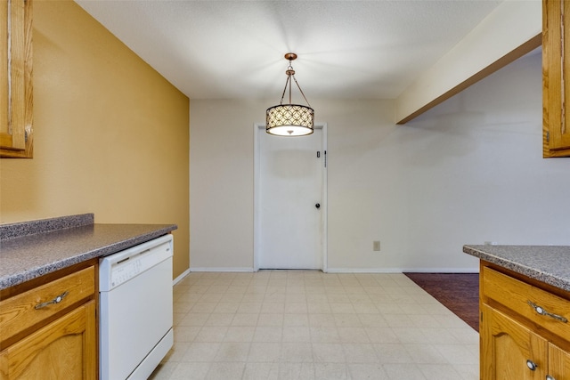 kitchen featuring white dishwasher and decorative light fixtures