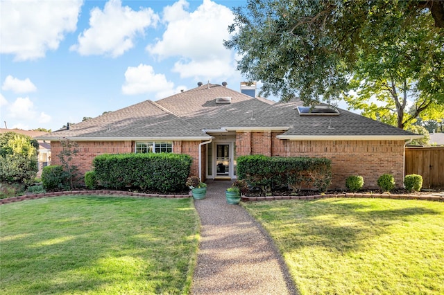 ranch-style house featuring a front yard