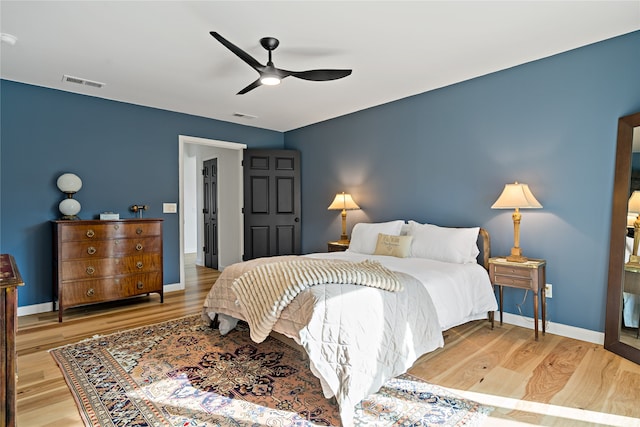 bedroom featuring light hardwood / wood-style floors and ceiling fan