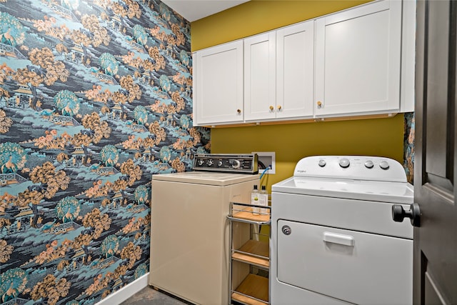 washroom featuring cabinets and washer and dryer