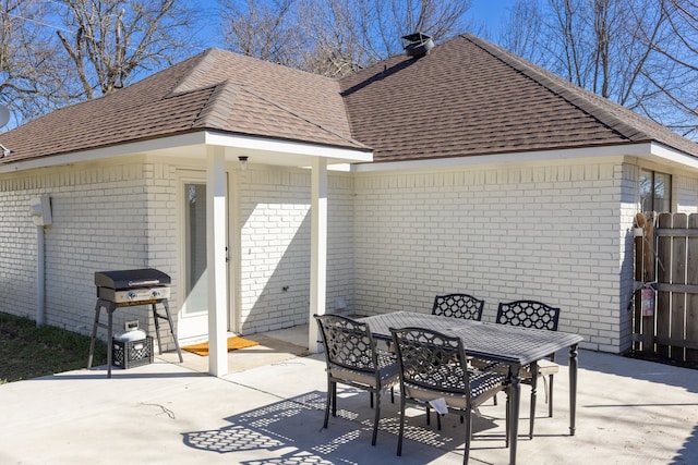 view of patio with outdoor dining space and grilling area