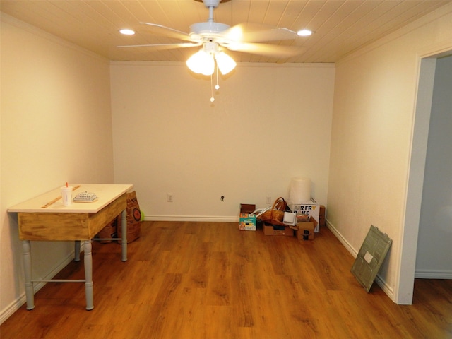 misc room with crown molding, hardwood / wood-style floors, and ceiling fan