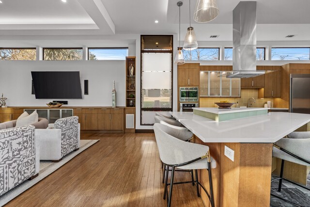 home office featuring wood-type flooring and ceiling fan