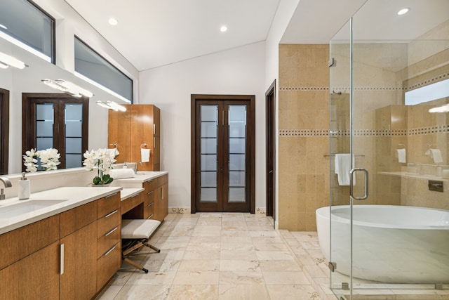 bathroom with vanity, plus walk in shower, and vaulted ceiling