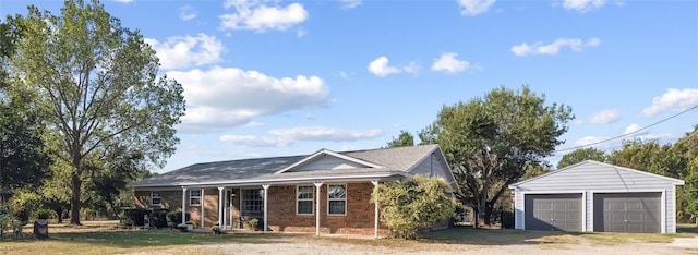 view of front of house with an outbuilding and a garage