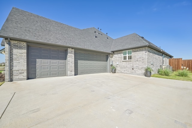 view of side of property featuring a garage