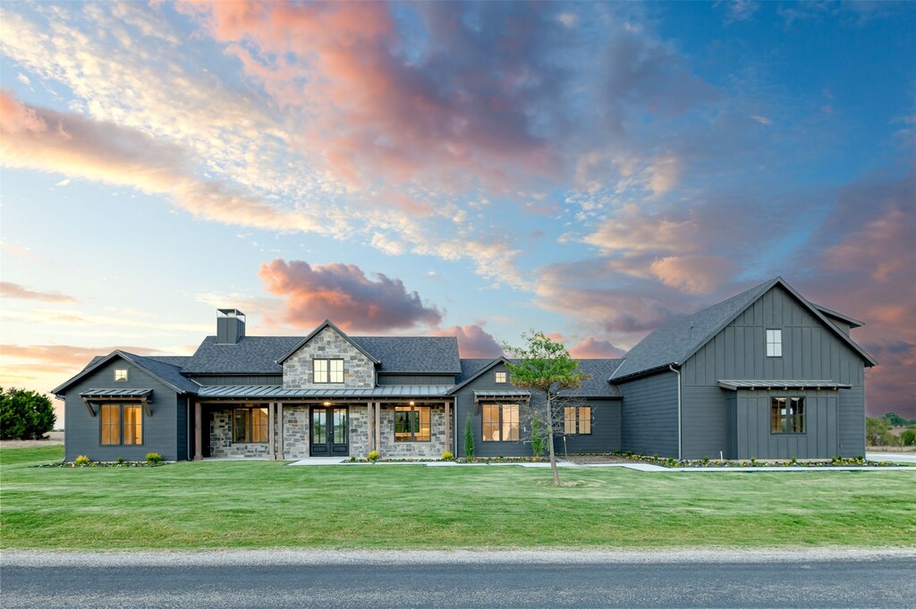 view of front of house with a yard