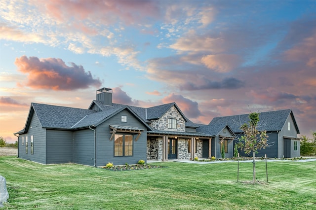 view of front of property with a lawn