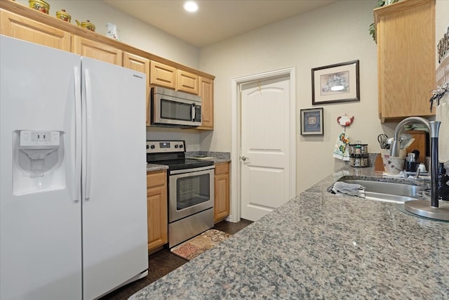 kitchen featuring light brown cabinetry, appliances with stainless steel finishes, sink, and dark hardwood / wood-style flooring