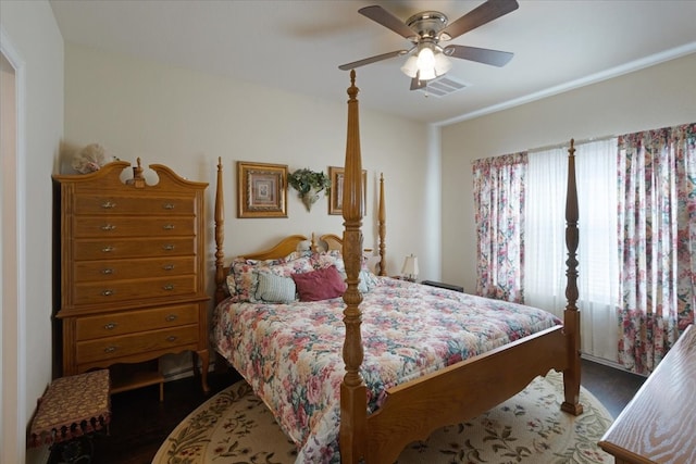 bedroom featuring dark wood-type flooring and ceiling fan