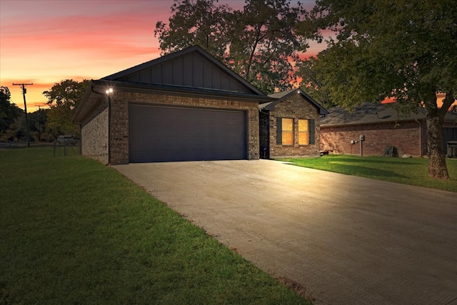 craftsman inspired home with a yard and a garage