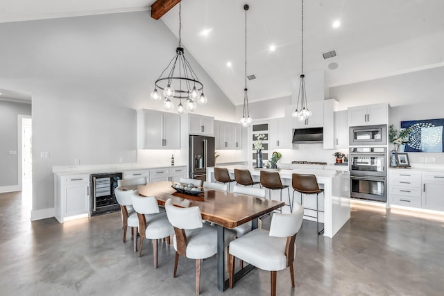 dining room featuring wine cooler, beam ceiling, high vaulted ceiling, and an inviting chandelier