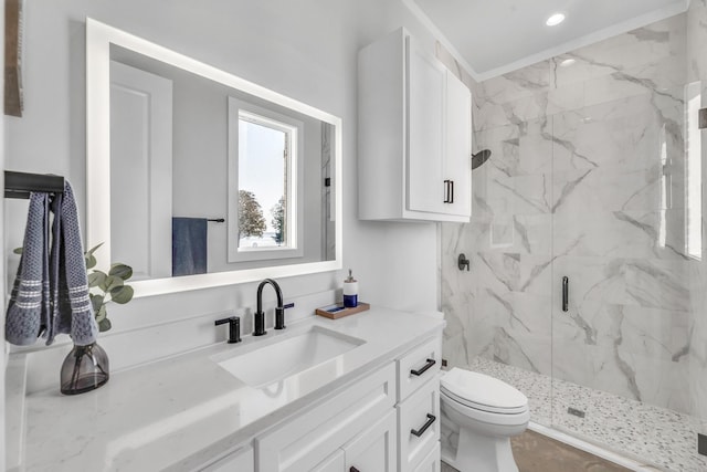 bathroom featuring vanity, toilet, and an enclosed shower