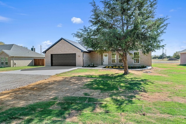 view of front facade featuring a front lawn and a garage