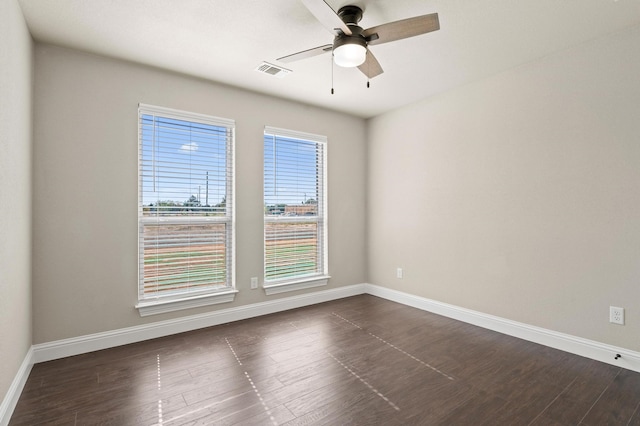 unfurnished room featuring ceiling fan and dark hardwood / wood-style flooring