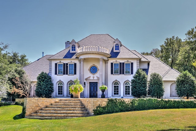 5804 Indianwood Ln, Fort Worth, TX 76132 - french provincial home featuring a chimney, stucco siding, and a front yard