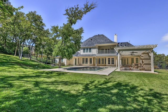 5804 Indianwood Ln, Fort Worth, TX 76132 - back of house featuring a lawn, french doors, and a balcony