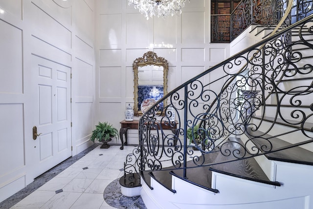 5804 Indianwood Ln, Fort Worth, TX 76132 - entryway featuring stairway, a decorative wall, and a notable chandelier