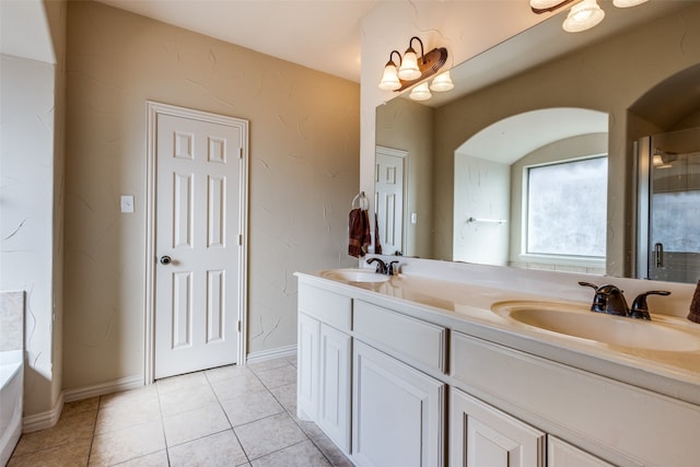 bathroom with vanity, shower with separate bathtub, and tile patterned floors