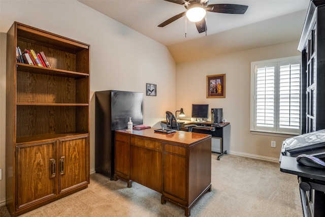 carpeted office space with lofted ceiling and ceiling fan