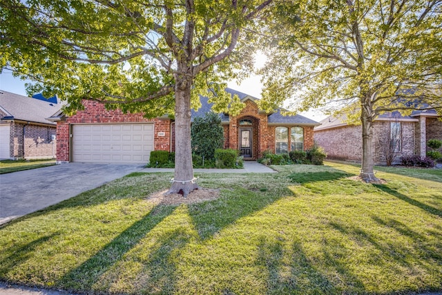 view of front of property with a garage and a front lawn