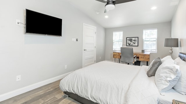 bedroom featuring lofted ceiling, hardwood / wood-style flooring, and ceiling fan