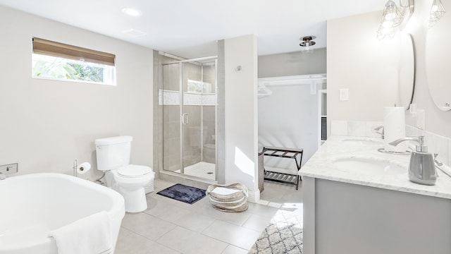 full bathroom featuring vanity, toilet, tile patterned floors, and separate shower and tub