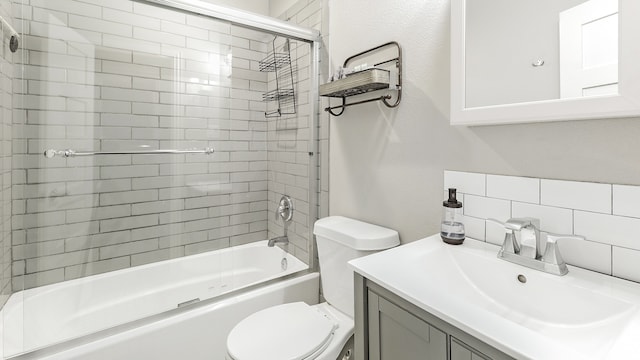 full bathroom with backsplash, vanity, combined bath / shower with glass door, and toilet