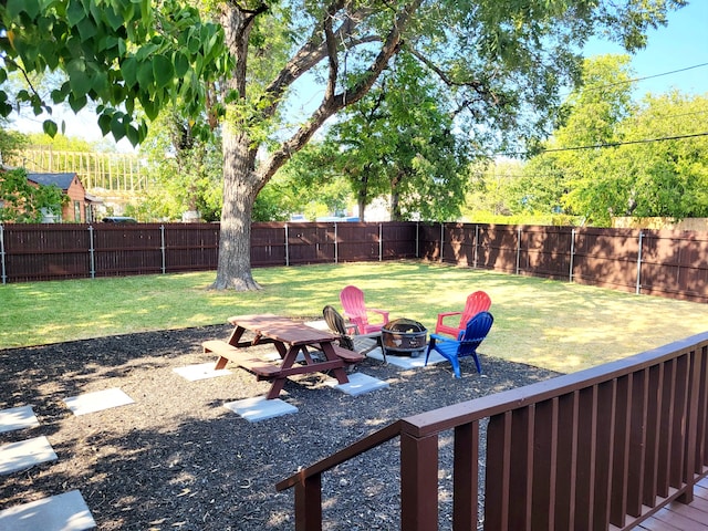 view of yard with a fire pit