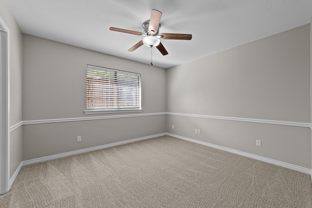 empty room with carpet and ceiling fan