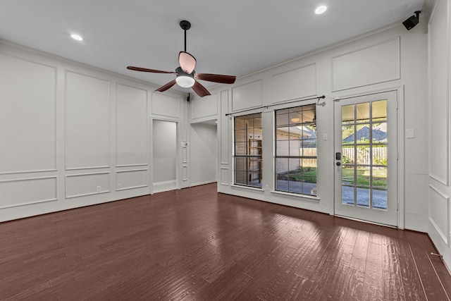 unfurnished room with ceiling fan, crown molding, and dark hardwood / wood-style floors