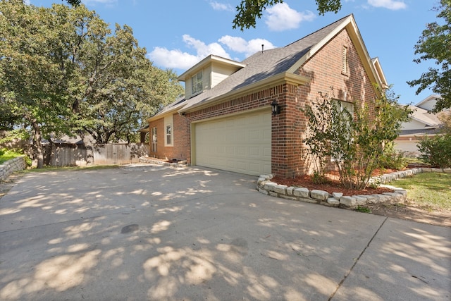 view of side of property featuring a garage