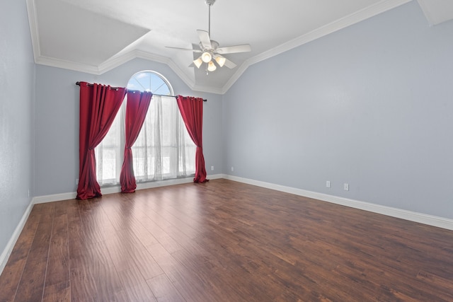 unfurnished room with lofted ceiling, ornamental molding, dark wood-type flooring, and ceiling fan