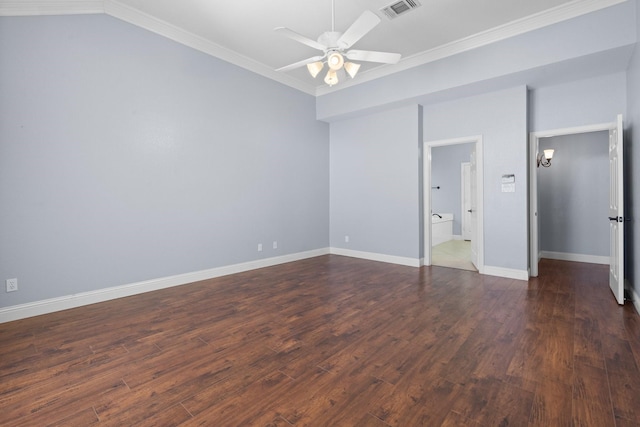 unfurnished bedroom featuring dark wood finished floors, visible vents, crown molding, and baseboards
