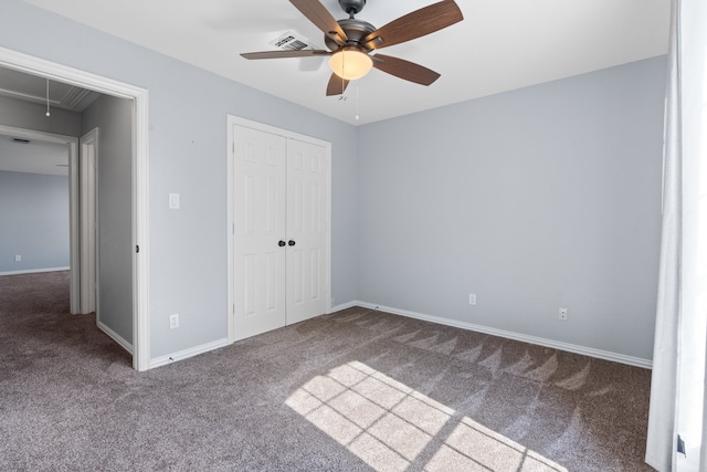 unfurnished bedroom featuring carpet, a closet, and ceiling fan