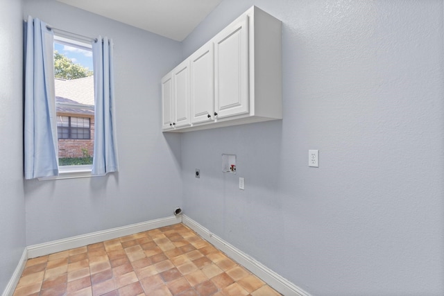 laundry room featuring baseboards, hookup for a washing machine, cabinet space, and hookup for an electric dryer