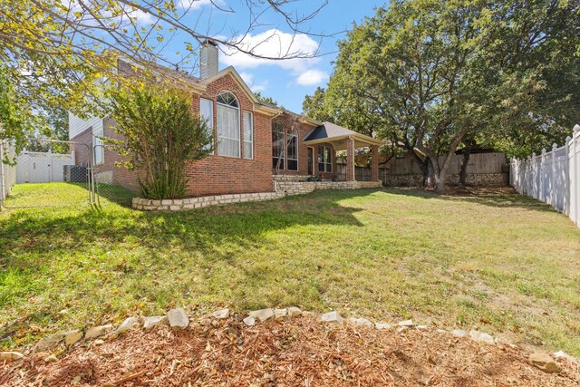 view of yard featuring a fenced backyard